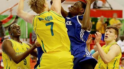 Australia’s Tom Wilson shows his defensive skills to deny France’s Luc Loubaki during tournament at Al Ahli Arena. Satish Kumar / The National