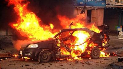 A blaze engulfs a car at the scene of an explosion in the Shiite Muslim Al Amin district of Baghdad on December 8. AFP