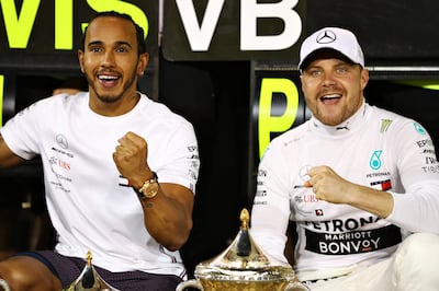 Despite Ferrari's pace, Mercedes drivers Valtteri Bottas, right, and Lewis Hamilton lead the standings after one win each. Getty Images