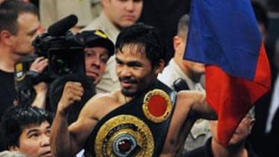 Manny Pacquiao celebrates after knocking out Ricky Hatton of England to win their Welterweight title fight in May.