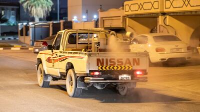 Sharjah municipal staff disinfect the streets of the emirate. Antonie Robertson / The National