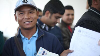Dev Thapa, renewing his passport, at the Nepalese Embassy in Abu Dhabi. Irene García León for The National.