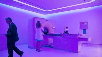 Registered Nurse Dorrie Emrick prepares the 64-slice CT scan machine for operation at the DNA Health Centre near the St. Regis Hotel in Abu Dhabi.