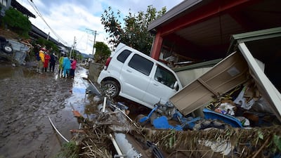 A car sits next to a badly damaged home in Nagano after Typhoon Hagibis hit Japan on October 12 unleashing high winds, torrential rain and triggered landslides and catastrophic flooding. The death toll from the disaster has risen steadily, and the national broadcaster early on October 15 said 58 people had been killed, according to authorities, while more than a dozen were still missing. AFP