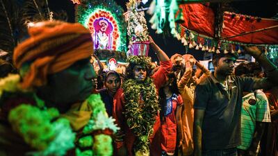 On February 7, Hindu devotees carrying milk pots on their heads as offerings as they make their way toward the Batu Caves temple during the Thaipusam festival in Batu Caves on the outskirts of Kuala Lumpur. The Hindu festival of Thaipusam, which commemorates the day when Goddess Pavarthi gave her son Lord Muruga an invincible lance with which he destroyed evil demons, is celebrated by some two million ethnic Indians in Malaysia and Singapore. AFP