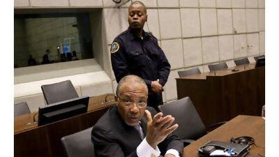 Charles Taylor, the former president of Liberia, waits in court yesterday for the start of the prosecution's closing arguments. He is being tried on 11 counts of war crimes and crimes against humanity.