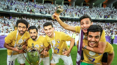 Al Ain players celebrate their President's Cup title just days after winning the Arabian Gulf League. Victor Besa / The National