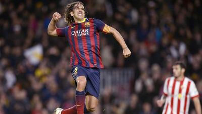 Carles Puyol started with Barcelona and may even retire as a true legend of the club in Spain. Lluis Gene / AFP