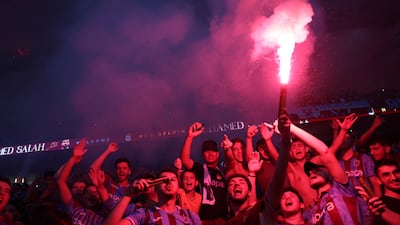 Trabzonspor fans with a flare inside the stadium. Reuters