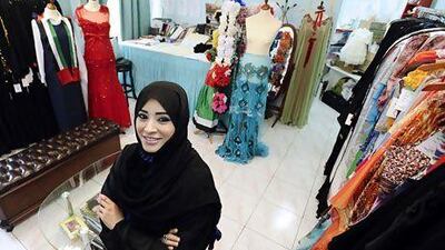 The Emirati fashion designer, Aysha Al Dhaheri, at her design office in Al Ain. Her plan is to retire from engineering and work full-time as a fashion designer, she says. Charles Crowell for The National