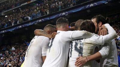 Real Madrid’s players jubilate the third goal scored by Portuguese striker Cristiano Ronaldo against Wolfsburg during the Uefa Champions League quarter final second leg match played at Santiago Bernabeu stadium in Madrid, Spain on 12 April 2016. EPA/JJ GUILLEN