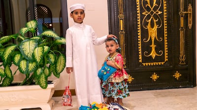 Lulua and her brother Rashid are ready for their Garangao night in Doha. She is dressed in a vibrant outfit and jewellery