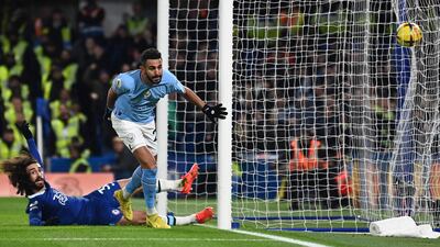 Manchester City's Riyad Mahrez celebrates scoring the opening goal in the Premier League game against Chelsea at Stamford Bridge on January 5, 2023. AFP