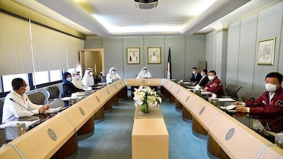 Kuwait's Health Minister Sheikh Basil al-Sabah (C), as he meets with members of a Chinese health delegation visiting Kuwait to exchange experiences on strategies, plans, and procedures to contain the coronavirus. AFP