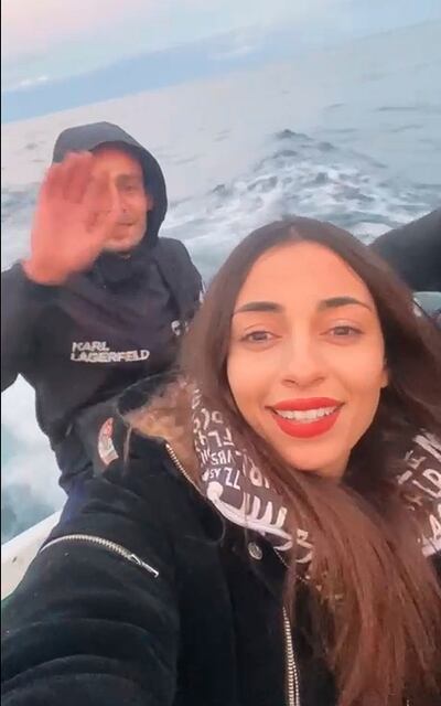 Chaima Ben Mahmoude and her fiance pose on the crossing from Tunisia to Lampedusa. AP