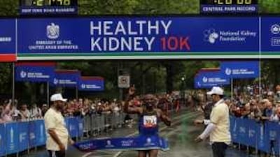 Tadese Tola crosses the finish line in the UAE-sponsored race in Manhattan yesterday.
