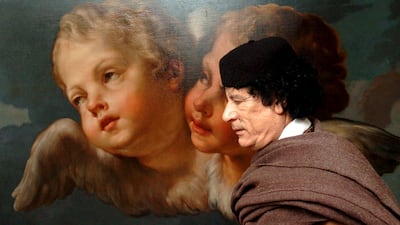 Libyan leader Muammar Qaddafi walks past a painting in the office of European Commission President Romano Prodi in Brussels in this April 27, 2004 file photo. REUTERS/European Commission/Handout