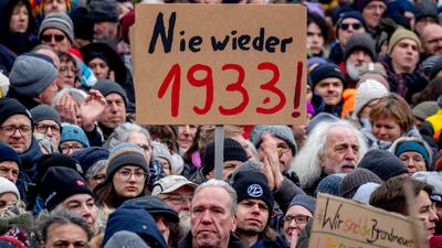 A 'never again 1933' poster is held up in Frankfurt at a protest against the AfD party and right-wing extremism on Saturday. AP