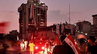Anti-government protesters gather during a demonstration at sunset in Baghdad, Iraq. AP Photo