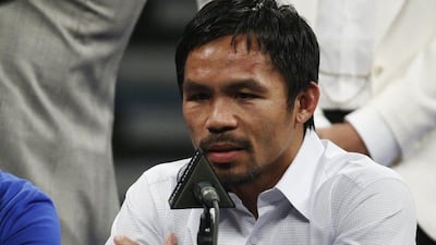 Manny Pacquiao answers questions during a press conference following his welterweight title fight against Floyd Mayweather last Saturday. John Locher / AP / May 2, 2015