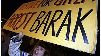 A woman demands the arrest of the Israeli defence minister, Ehud Barak, during a demonstration against his visit to the British Labour Party's annual conference in Brighton, England, last month. The foreign office upgraded Mr Barak's visit from private to official to give him diplomatic immunity.
