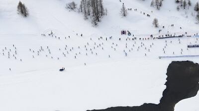The race goes over 42km from Maloya to S-chanf. Around 13,000 skiers take part in the race. Gian Ehrenzeller / EPA