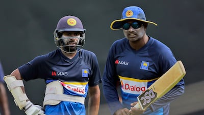 Sri Lanka's batting coach Avishka Gunawardena, right, instructs batsman Niroshan Dickwella during a practice session on Wednesday. Sri Lanka have performed poorly in recent times. Eranga Jayawardena / AP Photo