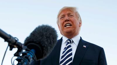 President Donald Trump speaks to media before boarding Air Force One at Elko Regional Airport, Saturday, Oct. 20, 2018, in Elko, Nevada after a campaign rally. AP Photo/Carolyn Kaster