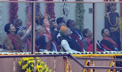 Singaporean prime minister Lee Hsien Loong takes photos as Indian prime minister Narendra Modi and other leaders watch the fly-past during India's 69th Republic Day parade in New Delhi on January 26, 2018. Prakash Singh / AFP