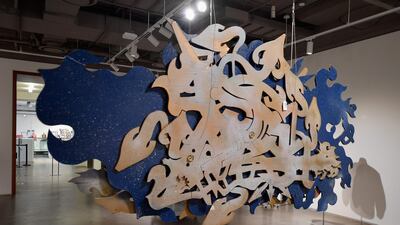 A logo sculpture by Phase 2 is displayed during a press preview at Sotheby's hip-hop auction. AFP