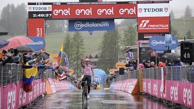 UAE Team Emirates' Tadej Pogacar crosses the finish line to win Stage 16, a ride from Livigno to Santa Cristina Val Gardena. AP