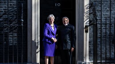 British Prime Minister Theresa May greets Mr Modi outside Number 10 Downing Street in London in 2018