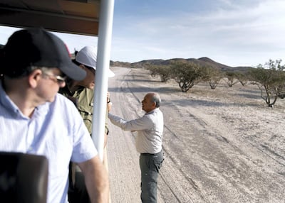 Nabil Saada, offers frankincense to a group of visitors to Sir Bani Yas Island. Reem Mohammed / The National