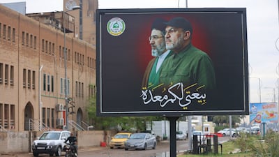 A billboard in Baghdad depicts Iraqi militia leader Abu Ala Al Walai alongside Iranian supreme leader Ayatollah Mojtaba Khamenei. AFP
