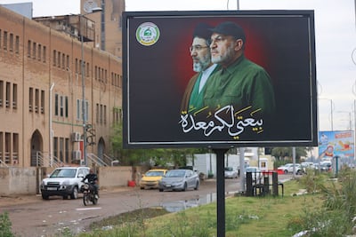 A billboard in Baghdad depicts Iraqi militia leader Abu Ala Al Walai alongside Iranian Supreme Leader Mojtaba Khamenei, as Washington ramps up pressure on Tehran-aligned groups with a $10 million bounty on the militia figure. AFP