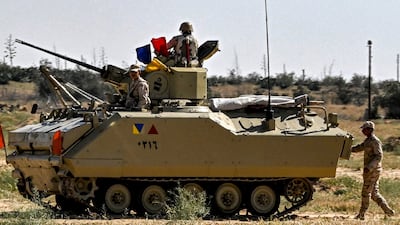 Egyptian army soldiers deployed near the Egyptian side of the Rafah border crossing Gaza. March 23, 2024. AFP