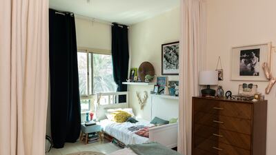 She divided the room with curtains to create a second bedroom for her son
