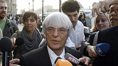 Bernie Ecclestone arrives at the hearing swamped by reporters in what has been another scandal that has hit the sport this year.