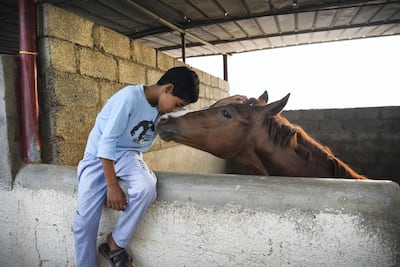 Muatassim Al Maskari, 10, says his horse is his friend. Courtesy of David Ismael