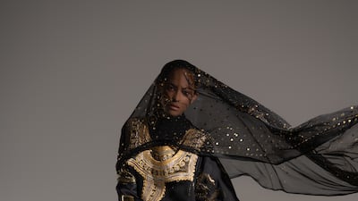 Once owned by Shaikha bint Ali Al Za’abi, this gold and black tunic kandurah and matching thawb date back to 1990. The shayla, which is heavy with mzarai metal work, is from circa 1988 to 1994. Ankle boots as before.