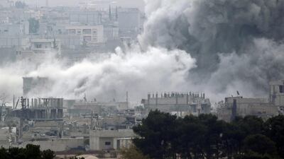 Smoke rises after an explosion following an air strike in central Kobani November 15, 2014. Picture taken from the Turkish side of the Turkish-Syrian border. Osman Orsal / Reuters