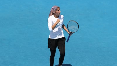 Meshkatolzahra Safi celebrates set point in her first round junior girls singles match against Anja Nayar at the 2022 Australian Open at Melbourne Park on January 23, 2022. Getty Images