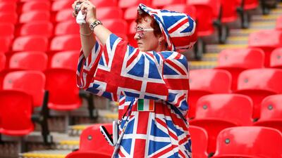 A British fan snaps a photo before the Britain - Brazil women's Group E football match at the London 2012 Olympic Games at Wembley. Stefano Rellandini/Reuters