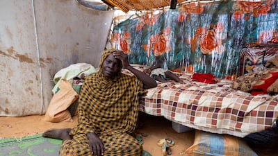 Thirty-four-year-old Sudanese refugee Halima Mahamat Abakar sits inside her shelter in the Adre refugee camp