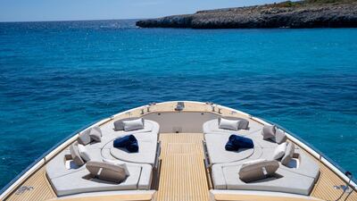 One of the yacht’s standout features is a spacious lounge area on the bow, fitted with cushioned sun pads. Courtesy Camper & Nicholsons