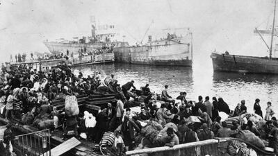 The Greek exodus from Smyrna in Turkey is the seminal event in Tsalikoglou's haunting novel. Topical Press Agency / Getty Images