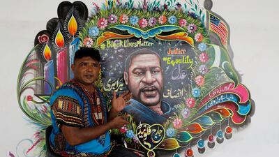 Ali painted candles burning in memory of George Floyd, as well as an American and Pakistani flag next to one another. Reuters