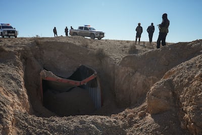 Syrian security personnel at the site of one of the recent strikes. Ahmad Fallaha for The National