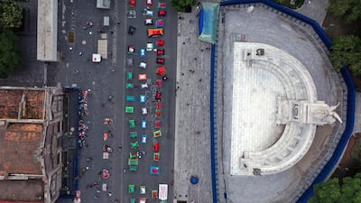 Anti-government protesters camp out on Juarez Street in Mexico City after the police prevented them from getting to the city's main square. AFP