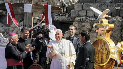 Pope Francis releases a white dove at Church Square in Mosul's Old City. Reuters